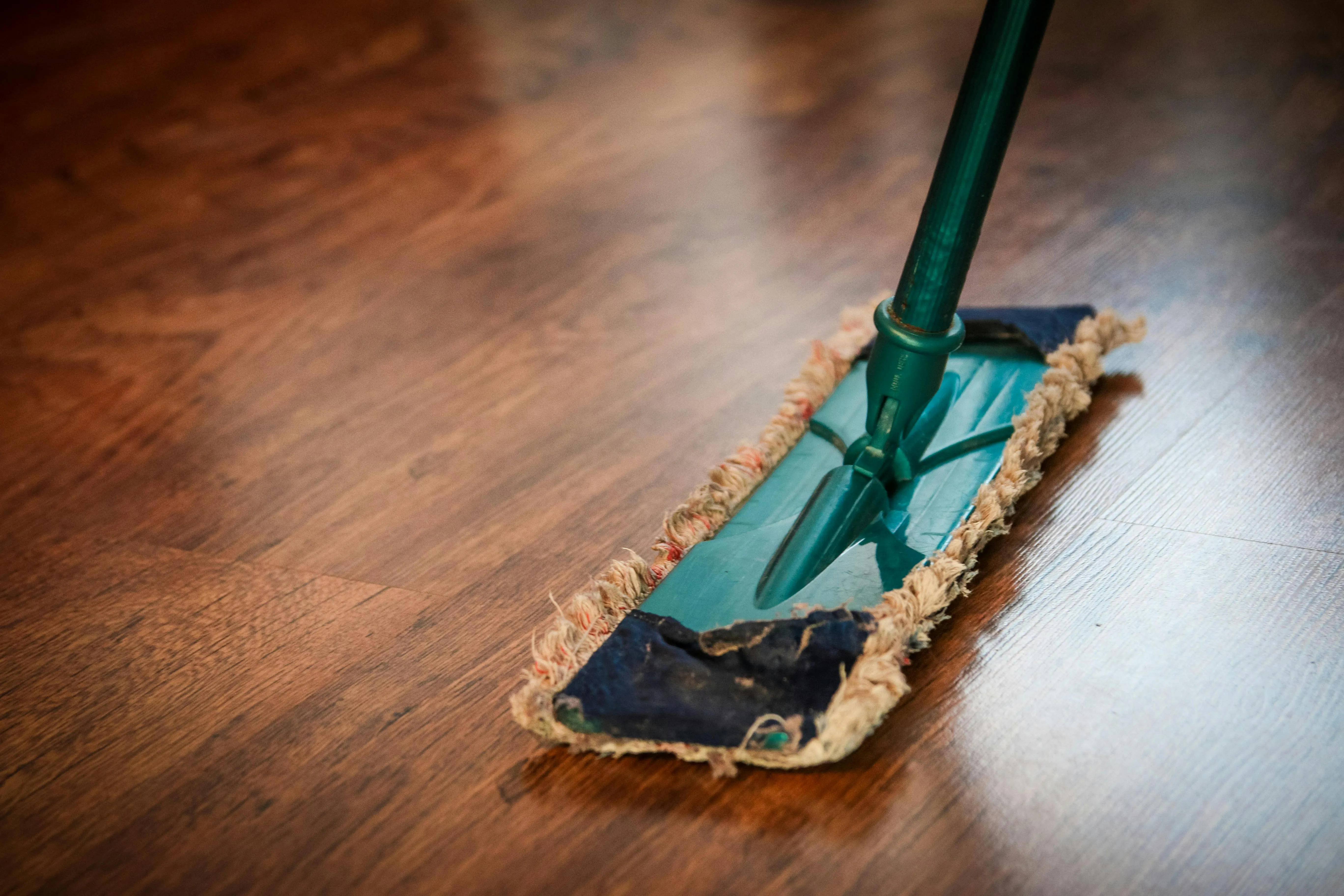 Freshly mopped hardwood floor after a home cleaning